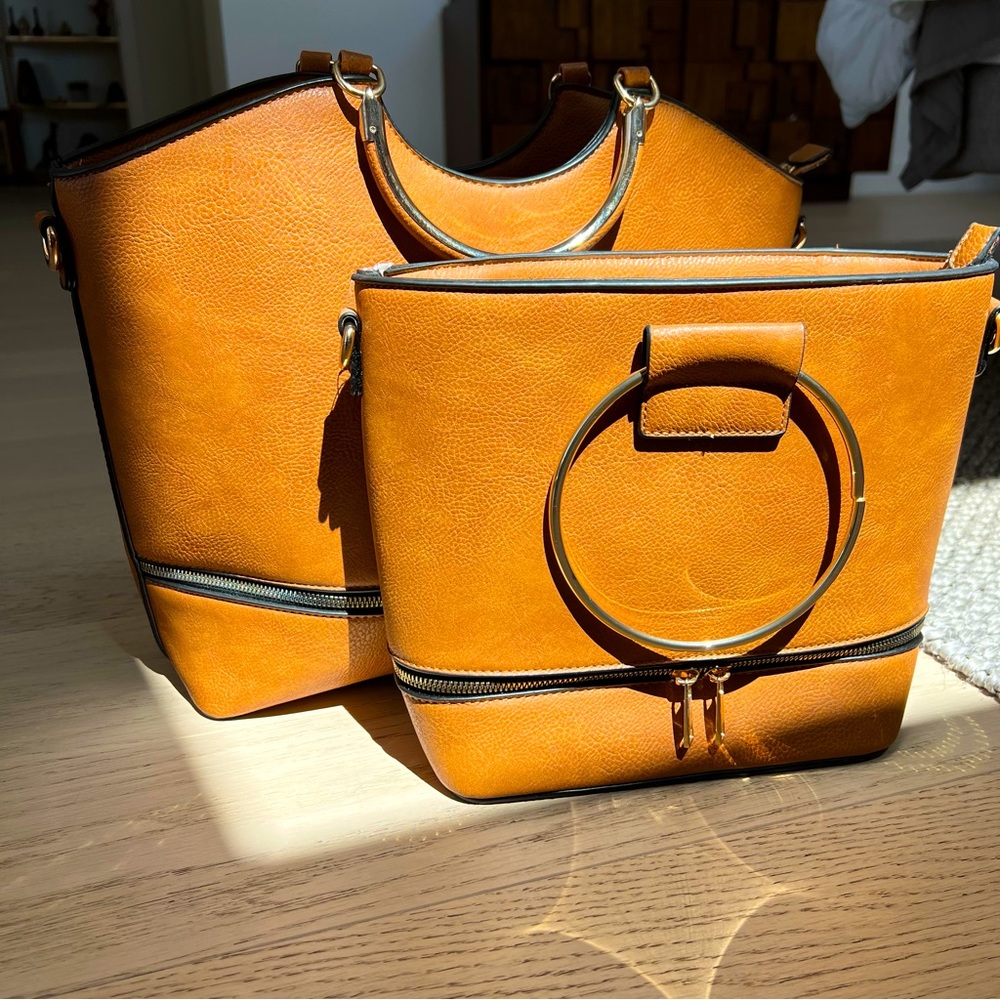 Two NWOT faux leather bags. Camel color w/gold trim. Cross body strap included.
